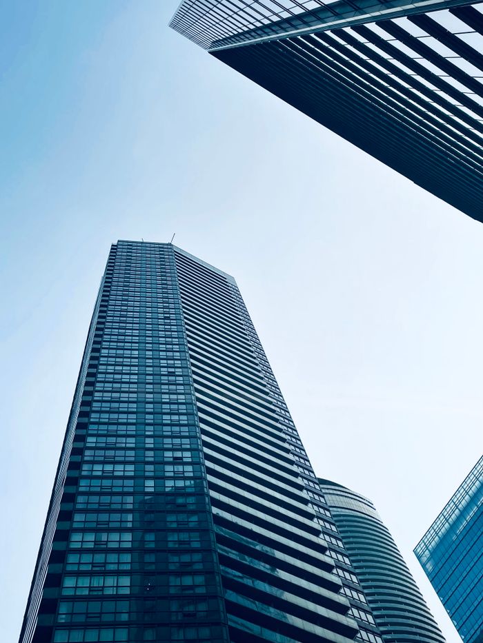 A view of towering skyscrapers in Toronto's financial district during the day.